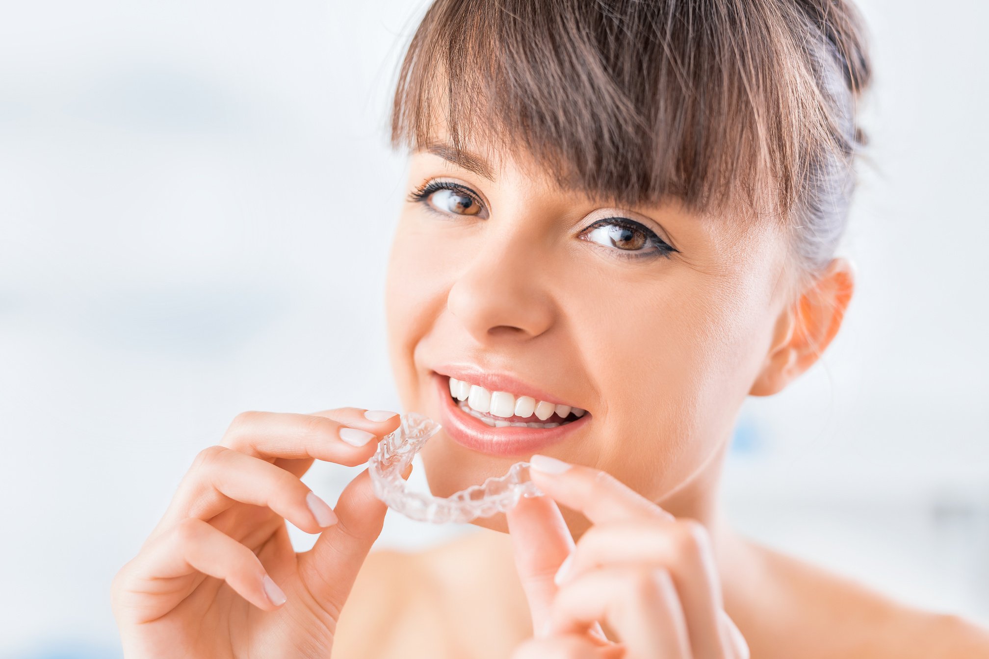 Woman Holding A Clear Plastic Brace